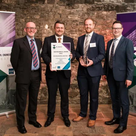 Photograph of four members of the Winchburgh design team accepting the Geotechnical award for the new M9 junction at the Scottish Civil Engineering Awards awards dinner.