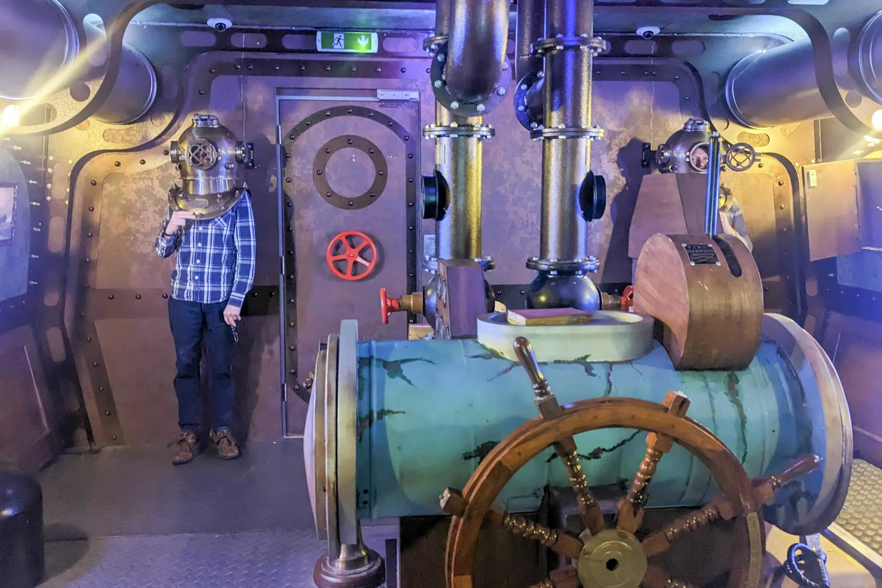In and Edinburgh Escape Room, styled to look like a ship or submarine, members of the Thomson Gray team wear vintage diving helmets.