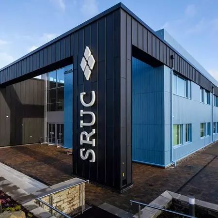 External photograph of the Rural and Veterinary Innovation Centre, a blue building with large SRUC logo on front