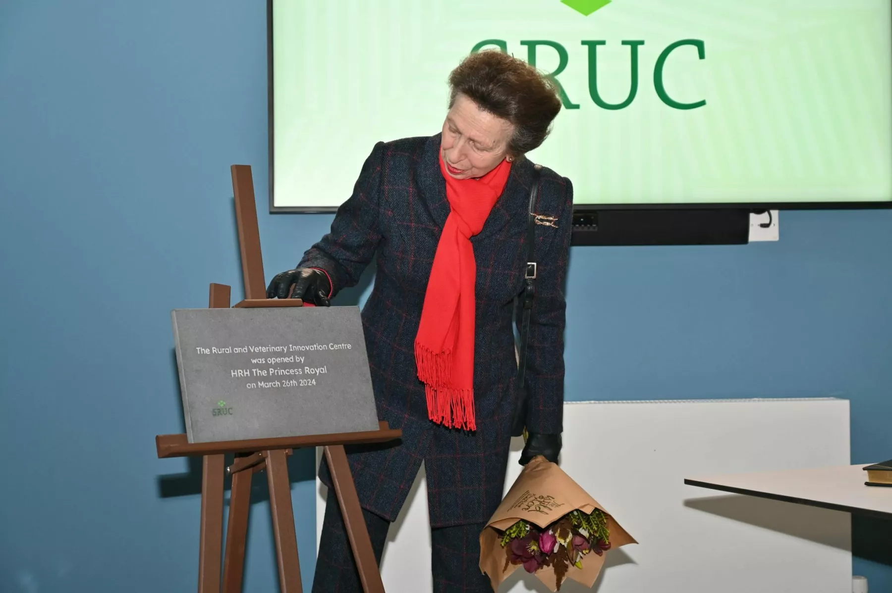Photograph of HRH The Princess Royal opening the new Innovation Centre standing next to plaque.