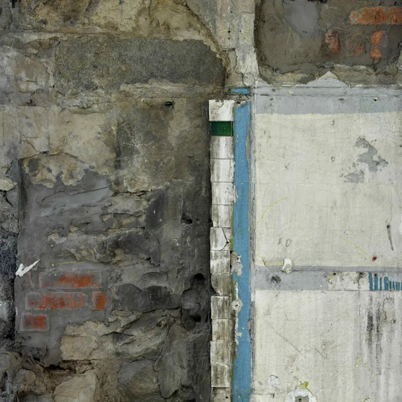 Detail from a defurbished interior in Edinburgh offices - stone and older tiling is revealed and left exposed.