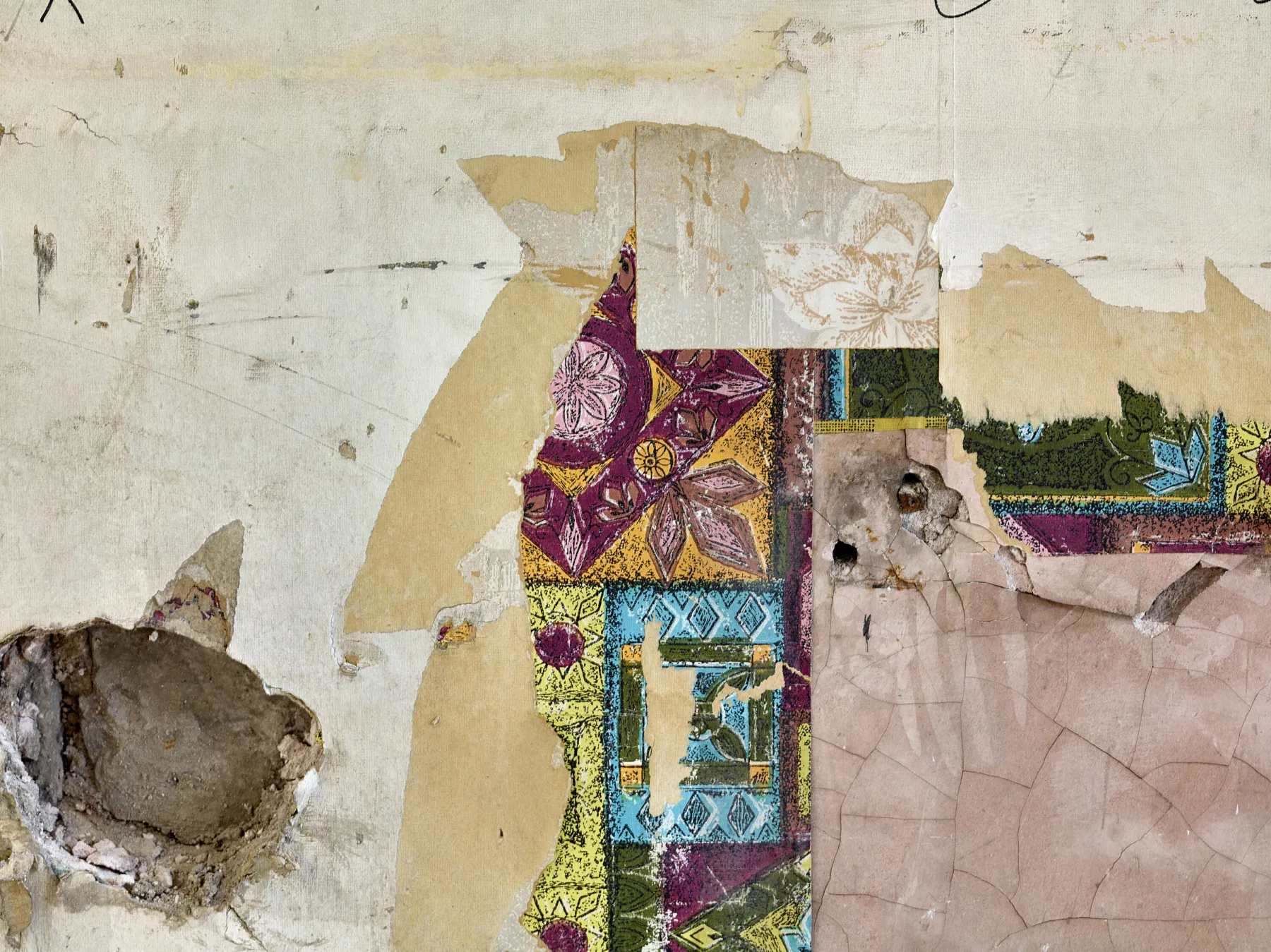 Detail from a defurbished interior in Edinburgh offices - Patterned wallpaper and old paint is revealed and left exposed
