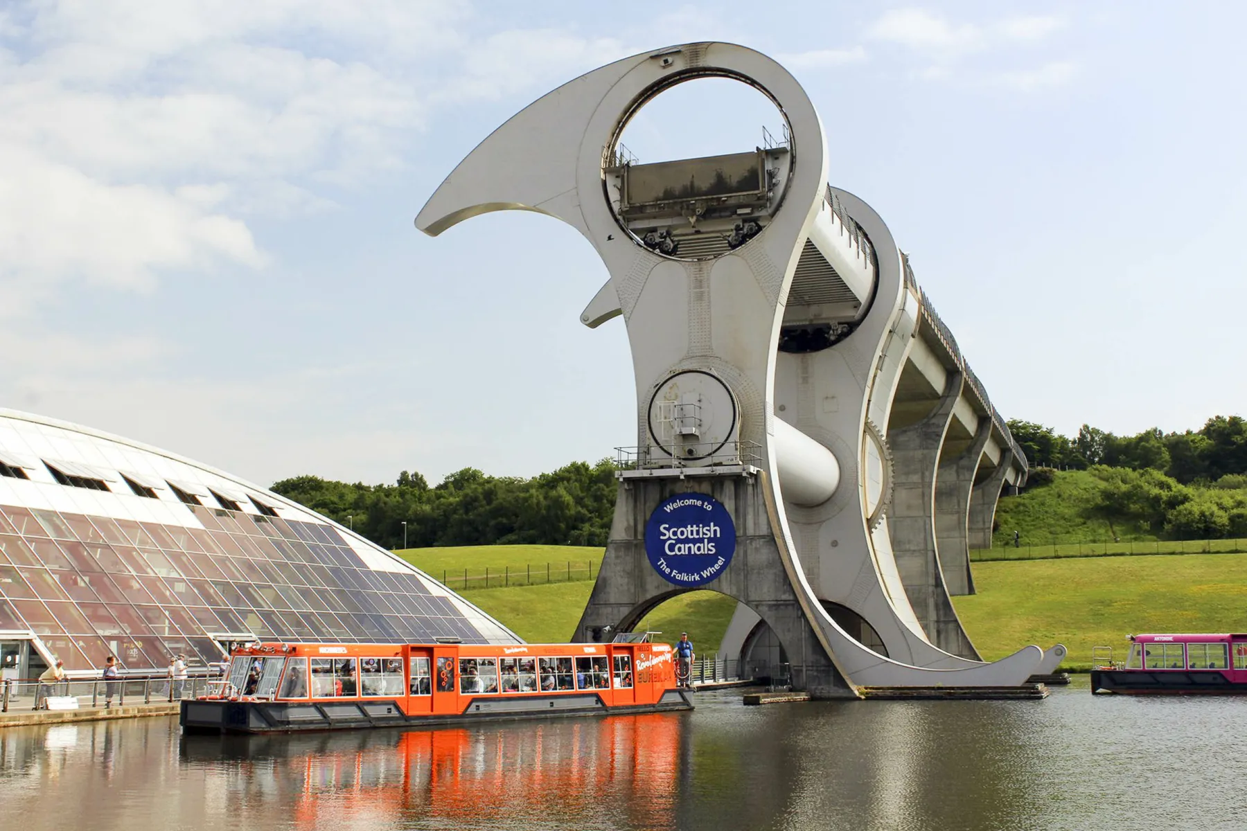 The Falkirk Wheel with canal boat in the basin.