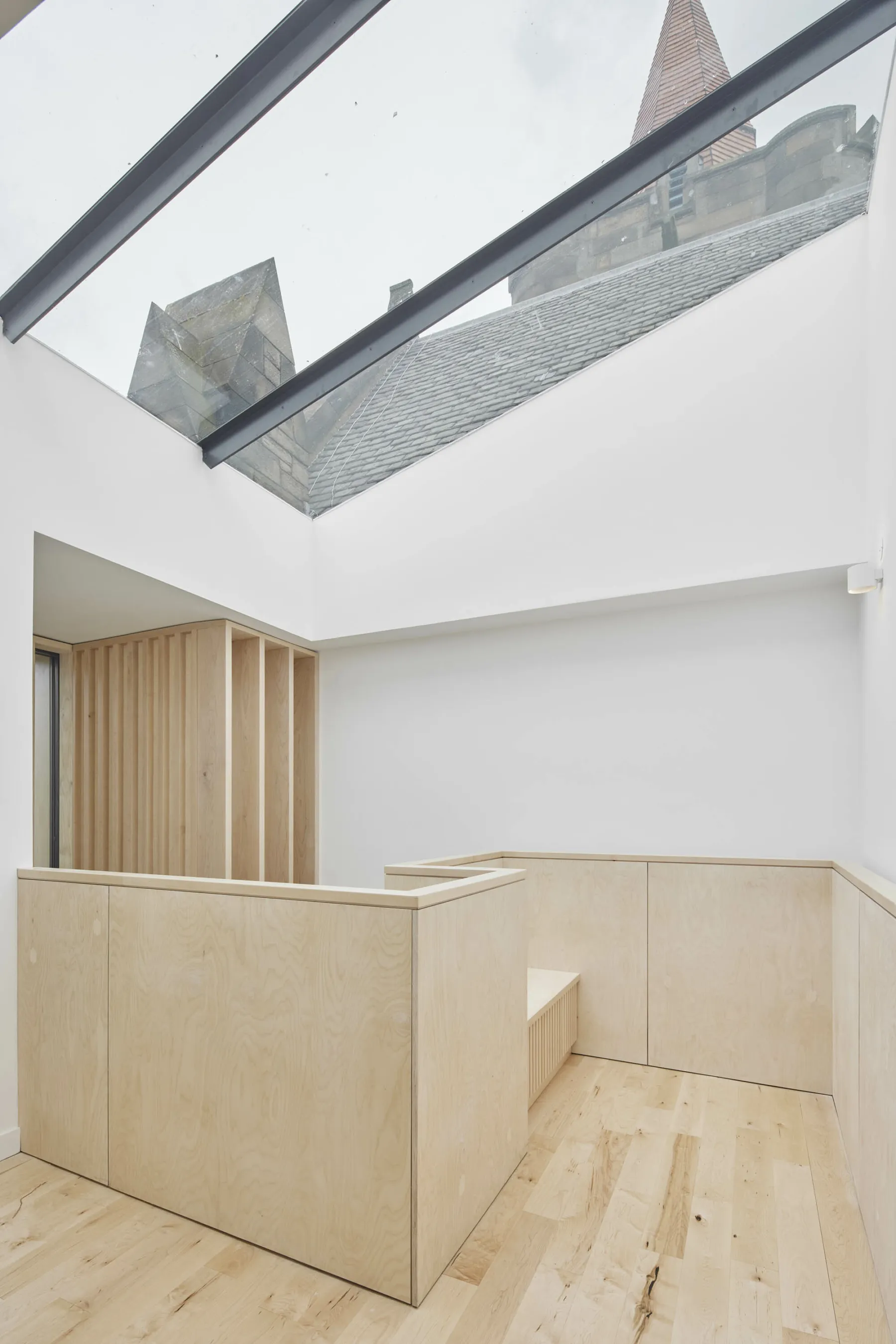 Large skylight at Greyfriars Charteris Centre, Edinburgh. Contemporary conversion of a church into a community centre. Wooden floors and pale wood solid bannister for the stair.
