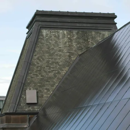 Solar panels on the slate roof at Edinburgh College of Art. Also show is the slated, steep mansard roof.