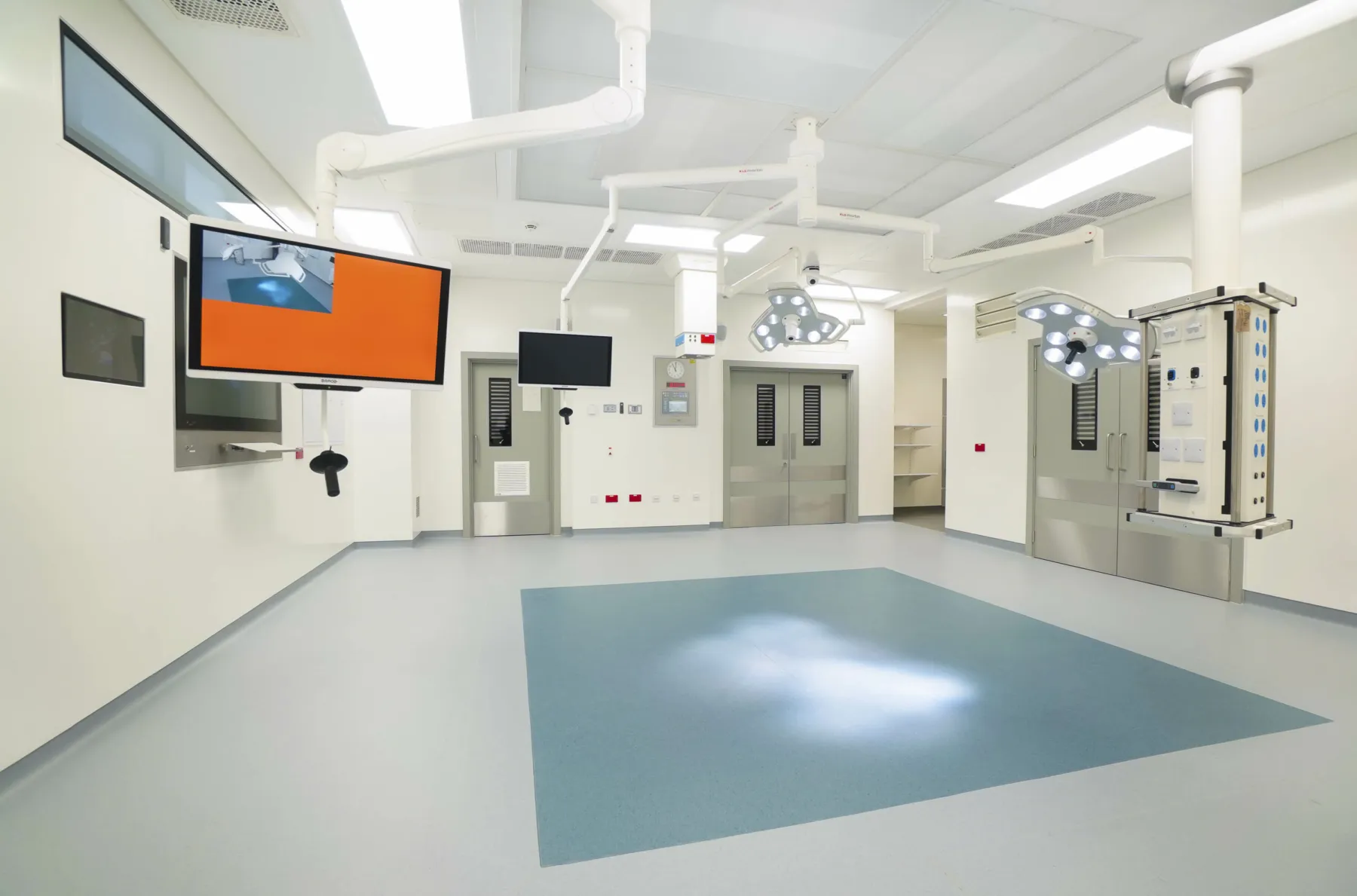 Orthopaedic operating theatre newly constructed at the National Treatment Centre - Fife Orthopaedics, Kirkcaldy. Lighting and screes are suspended on arms from the ceiling.