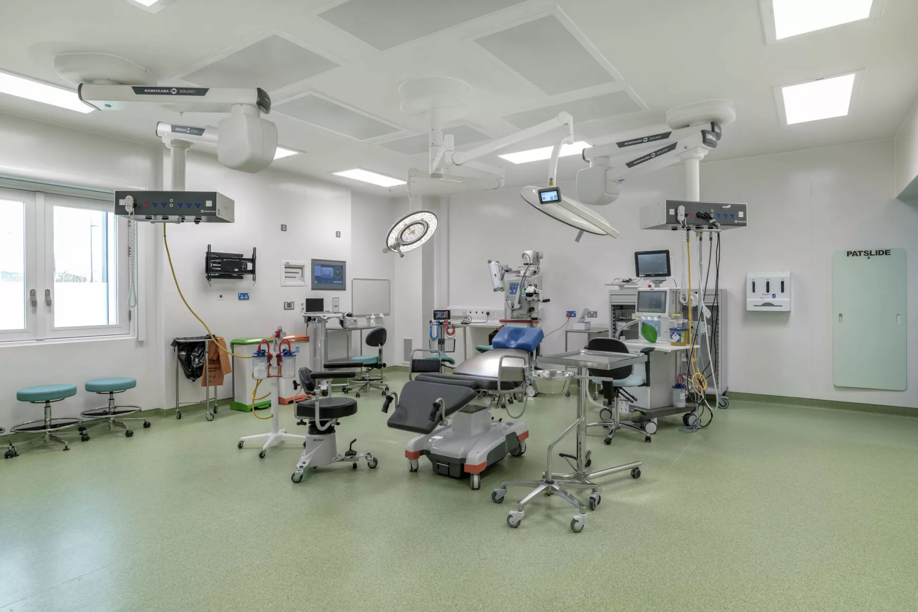 Opthalmology operating theatre at National Treatment Centre - Highland, in Inverness Scotland. Operating chair, lighting and equipment in a brightly lit theatre.