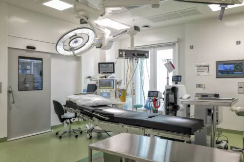 Interior view of hospital operating theatre at the National Treatment Centre - Highland, Inverness. Surgical lighting, operating table and equipment.