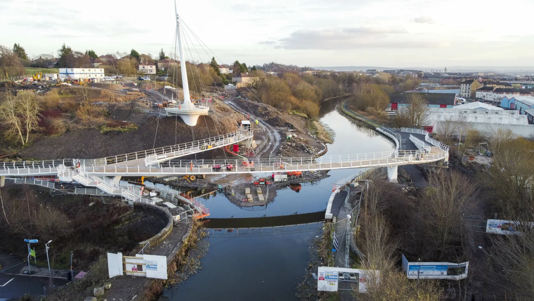 The construction of the Stockingfield Bridge across a junction of the Forth and Clyde Canal nears completion. Decks of the bridge are in place with cable stays from the tower.